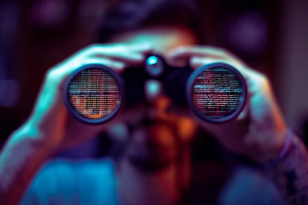 Cybercriminal using binoculars to read private company data